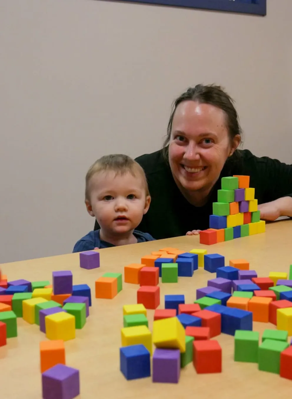 mother and child playing with blocks