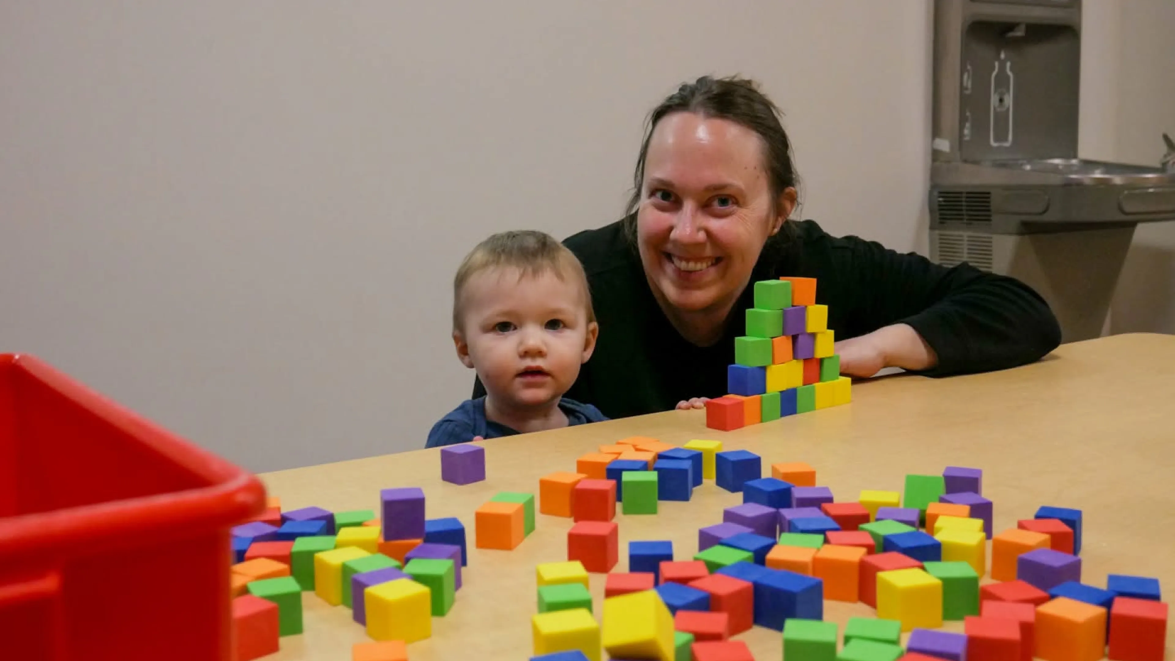 mother and child playing with blocks